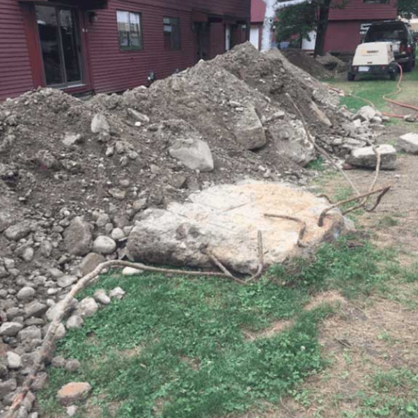 pile of debris after digging out around home foundation