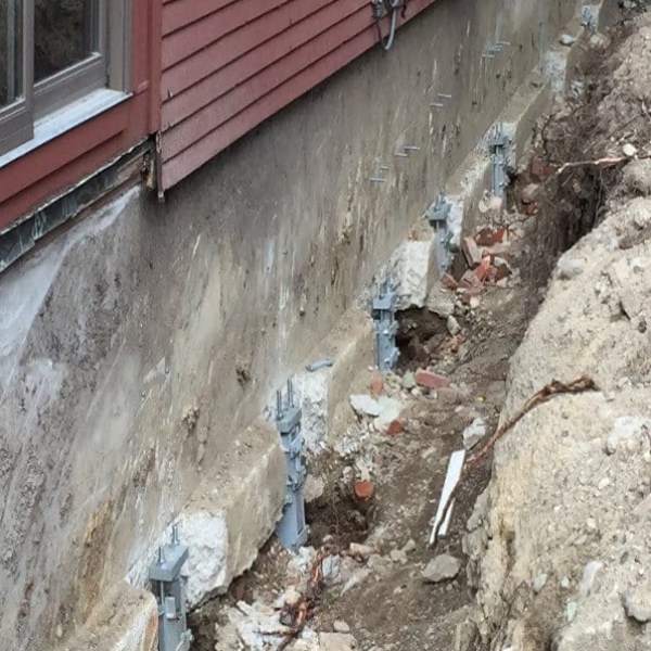 five new helical piers on foundation