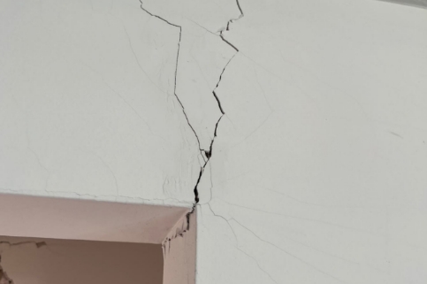 thin crack from door frame to the ceiling