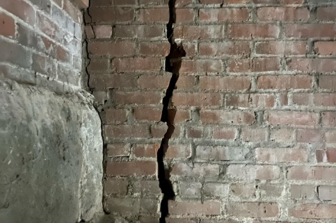 long crack in foundation brick on old home