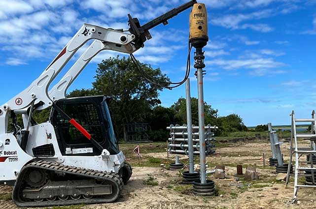 Atlas Systems installing with a Bobcat